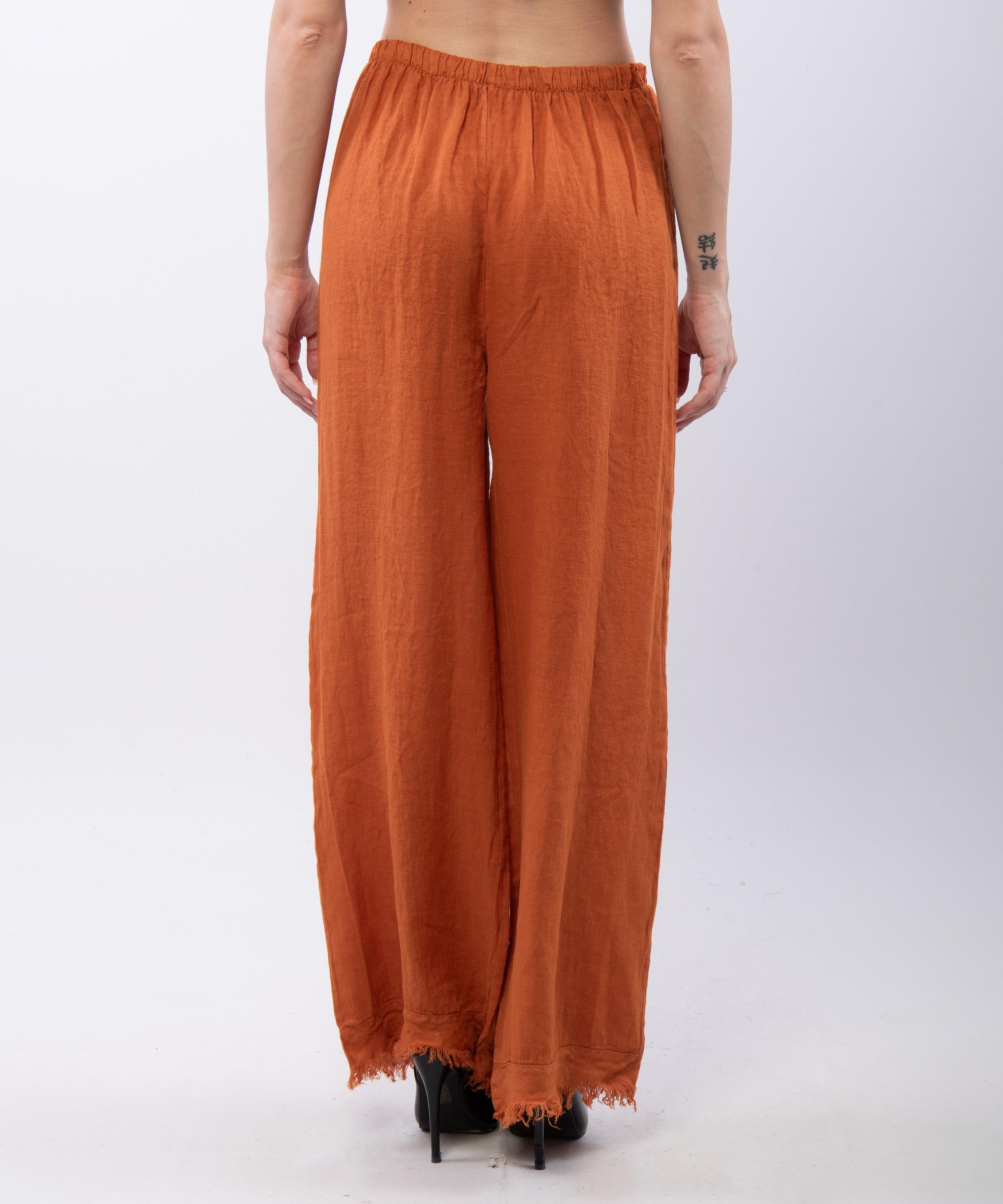 Pantalone palazzo con frange sotto in lino