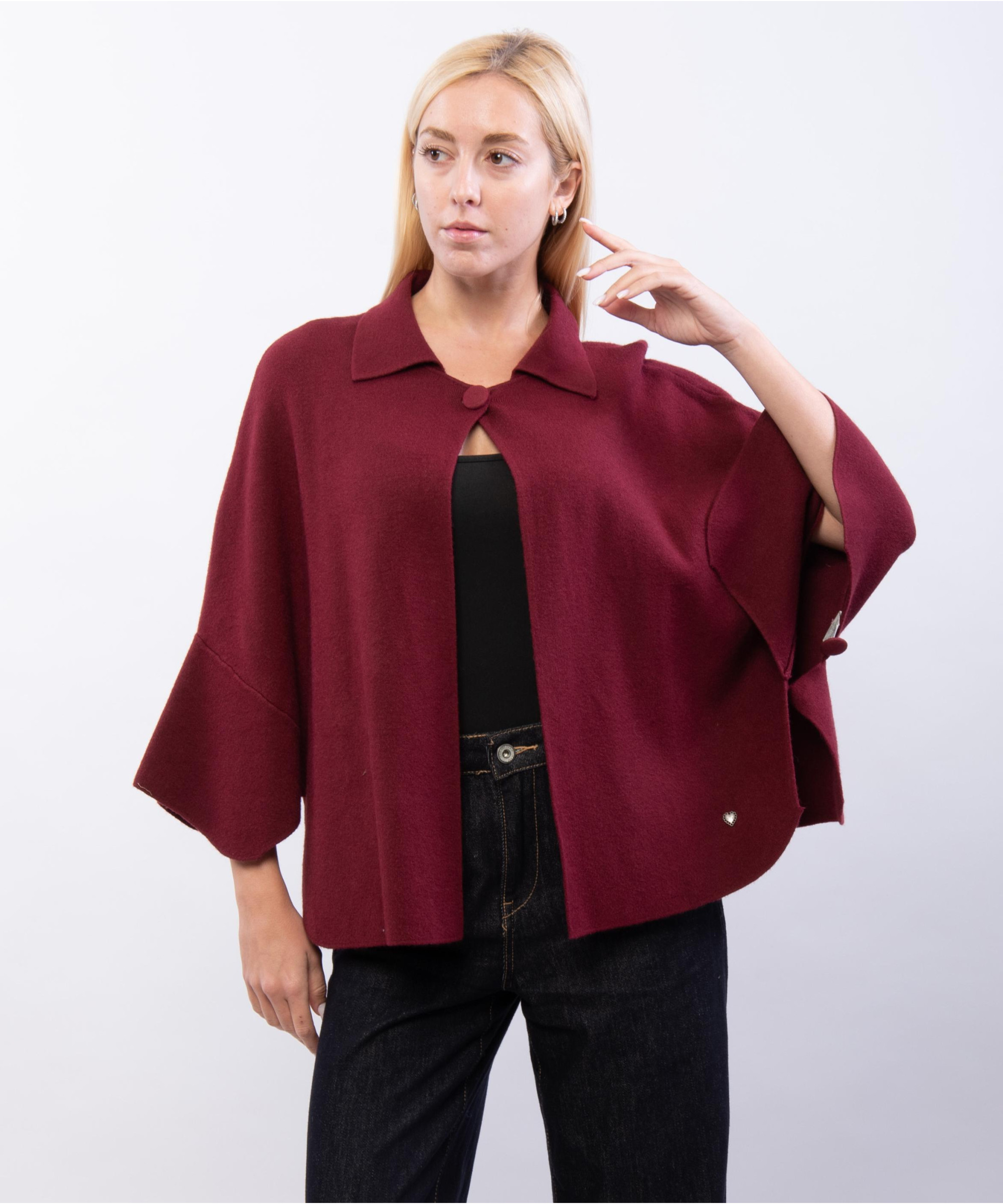 poncho in maglia con colletto