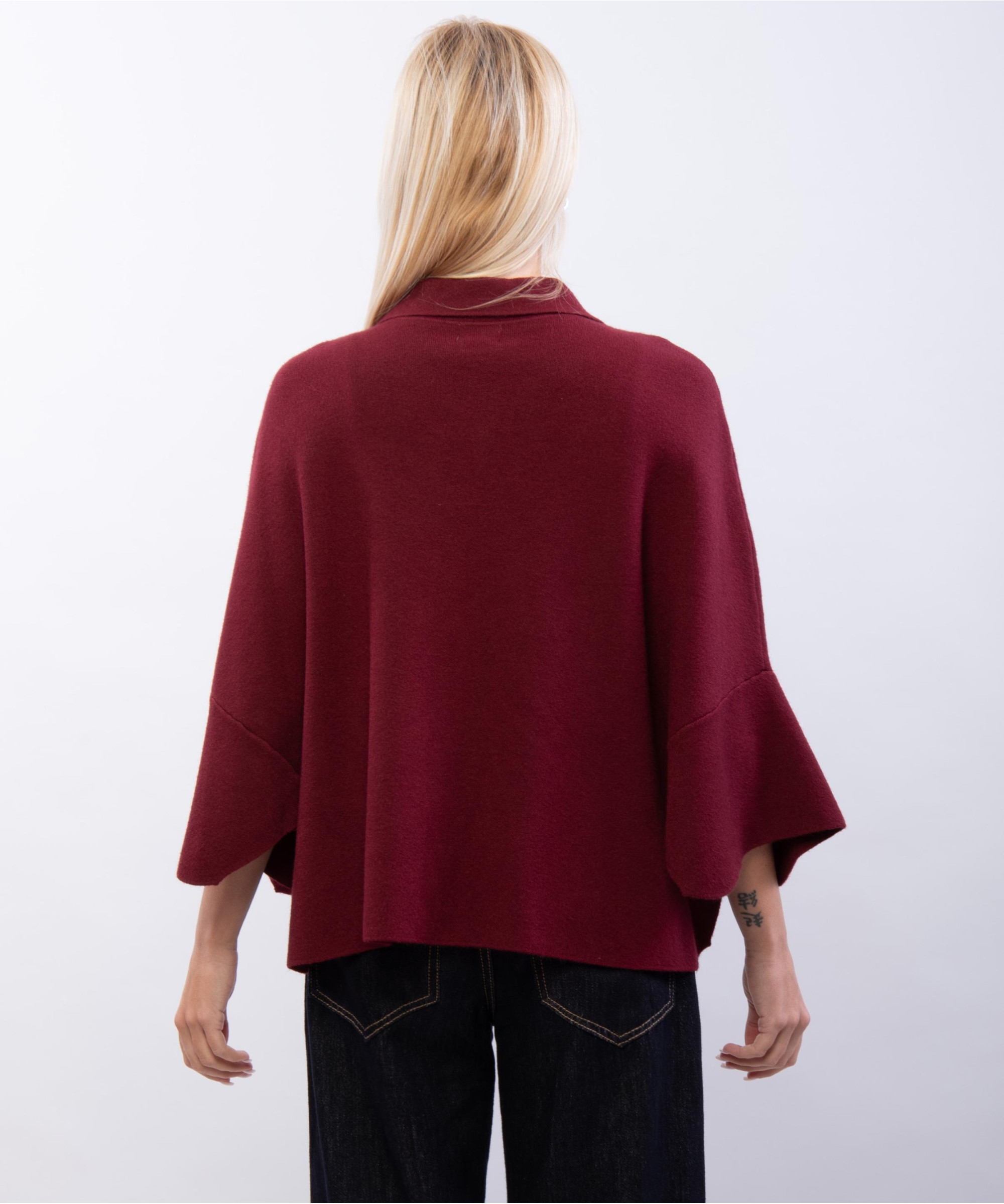 poncho in maglia con colletto