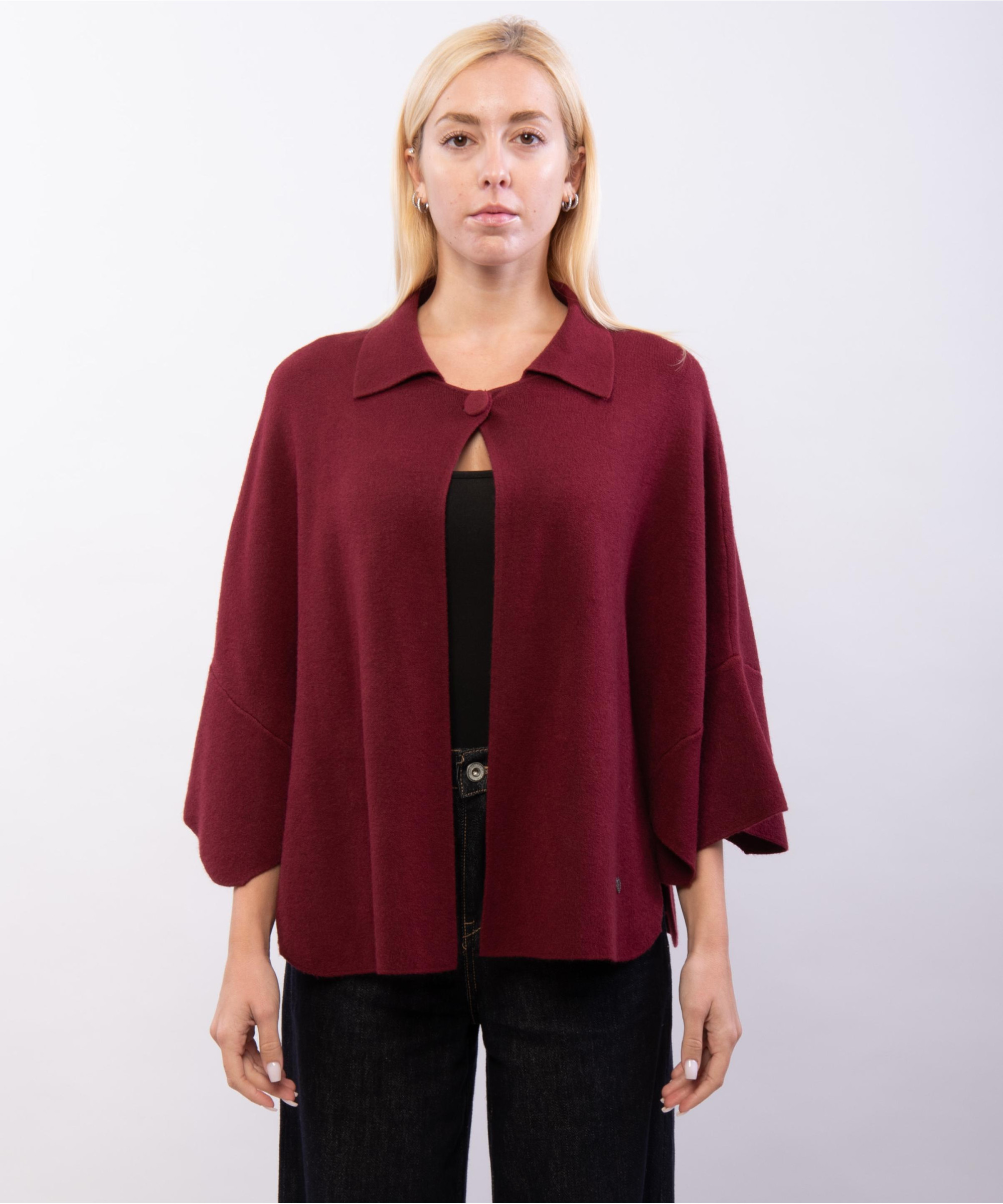 poncho in maglia con colletto