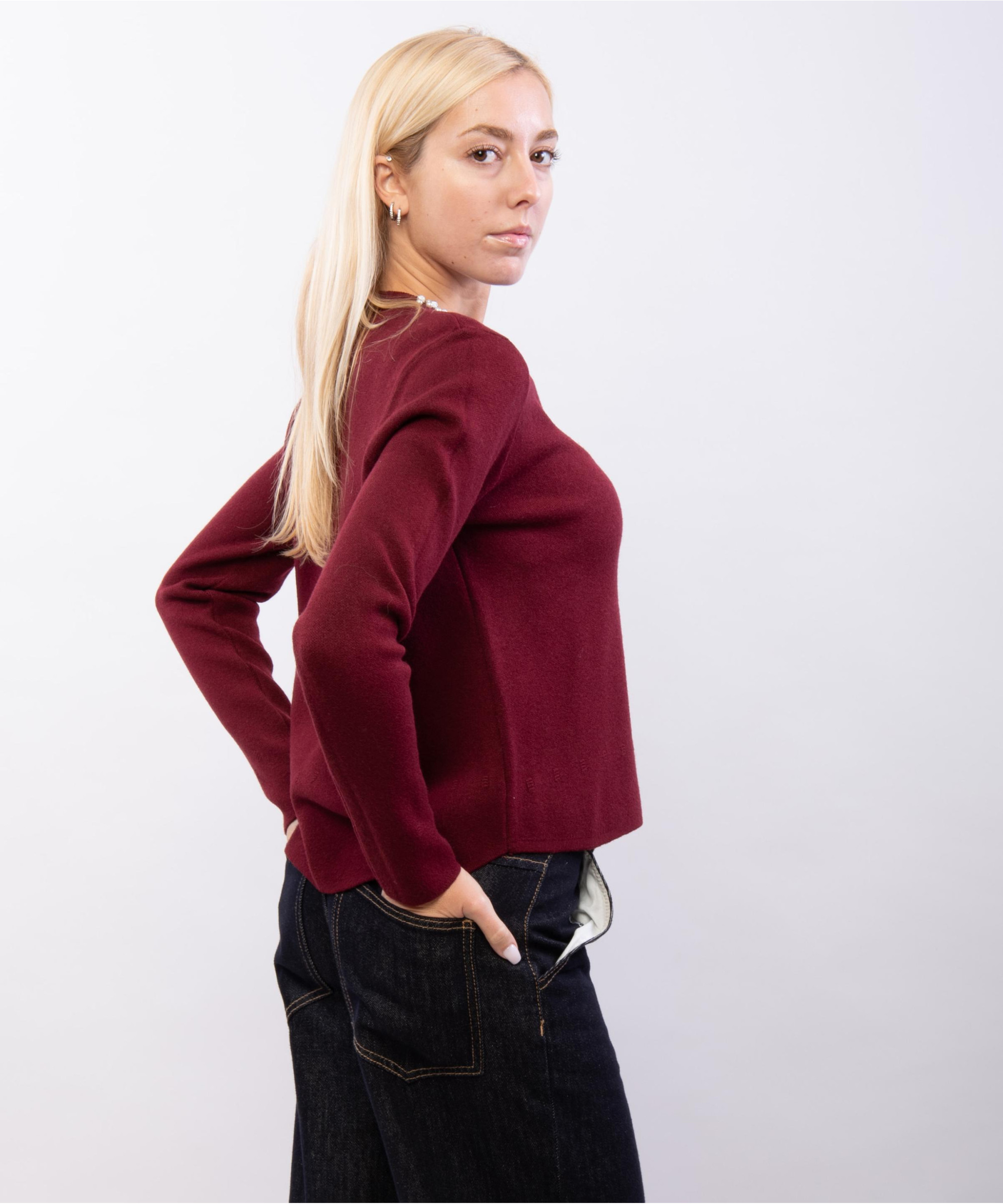 Maglieria con accessorio al collo
